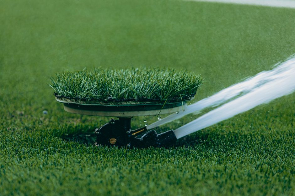 sprinkler watering newly installed sod during establishment period